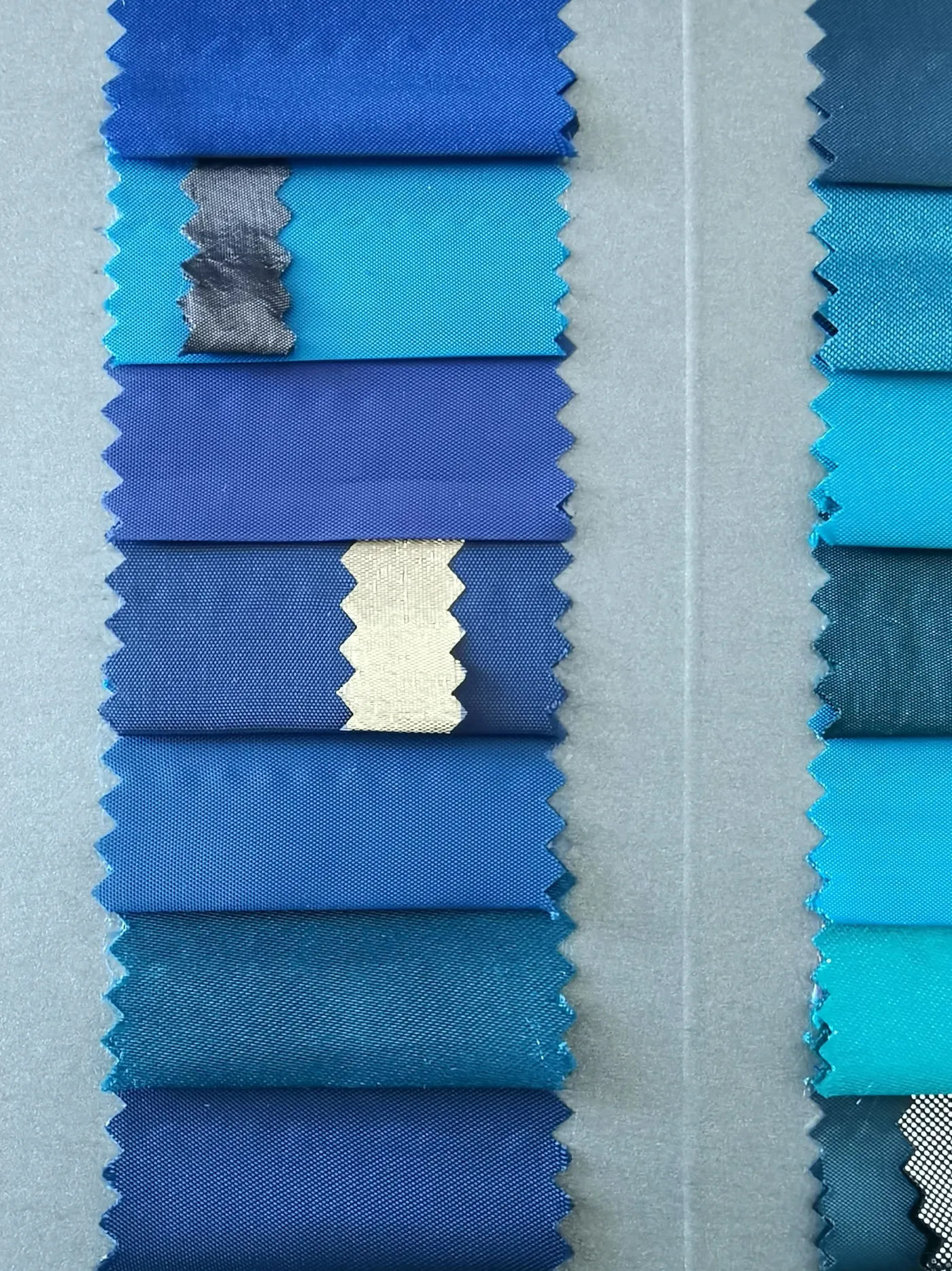 Blue fabric swatch cards used to compare custom color and texture options